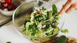 a bowl of salad with a spoon