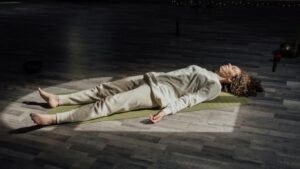 a woman lying on a mat