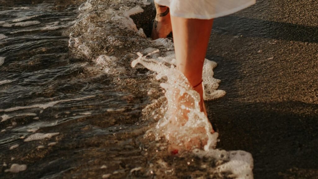 a person walking on the beach